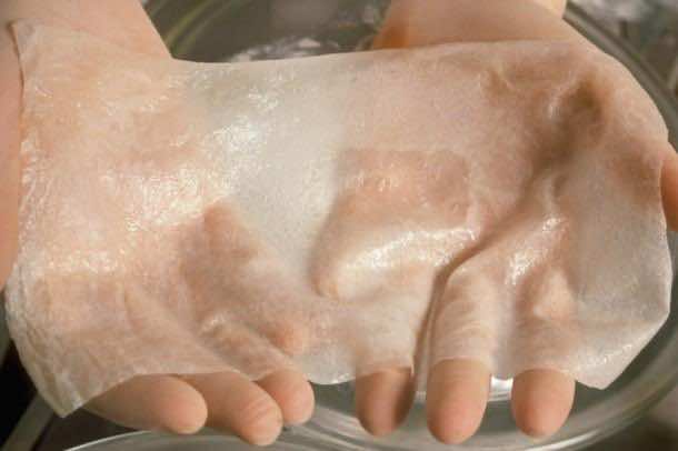 Scientist's Hands Hold Artificial Skin