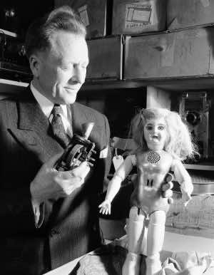 Collecter, Ward Harris, holds a talking doll with a metal torso that was invented by Thomas Edison, in San Francisco, Calif., Feb. 9, 1949. Harris holds in his other hand the inside mechanicals of the doll of which there is a wheel that contains phonograph impressions. Sound comes out of he cone at top of the doll and through holes below its neck. Edison gave the doll to the daughter of an expressman in Orange, N.J. when she was ill. It is one of only two dolls that are known to exist. The other doll is in the Henry Ford collection. (AP Photo/Ernest K. Bennett)