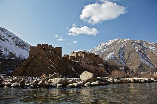 A group of houses sit over a rocky foundation across the river in the Dara District of Panjshir Province, Afghanistan, Jan. 3, 2010. (U.S. Army photo by Sgt. Teddy Wade/Released)