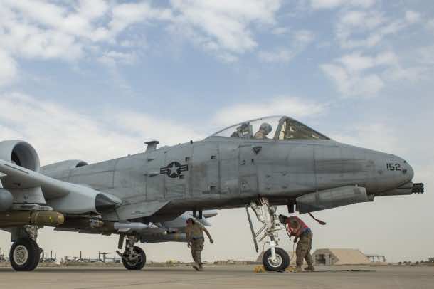 U.S. Air Force Airmen arm weapon systems on an A-10 Thunderbolt II prior to a mission supporting Operation Inherent Resolve in Southwest Asia, Jan. 31, 2015. (U.S. Air Force photo by Senior Airman James Richardson/AFCENT/Released)