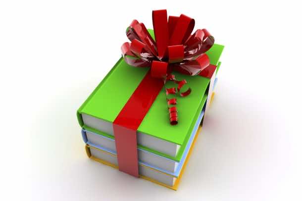 Three colored books with a ribbon like a present