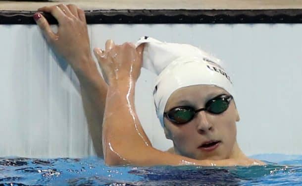 Why Olympic swimmers wear two caps 