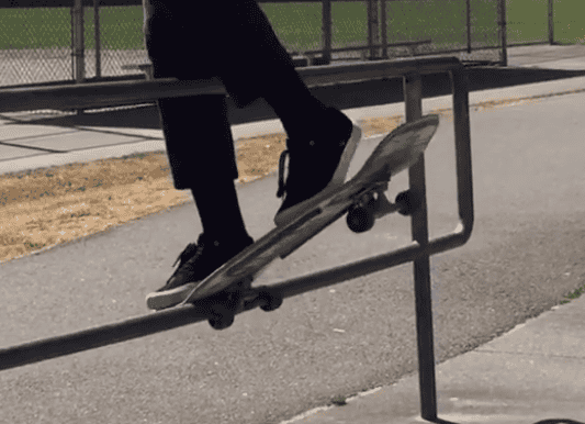 Watch This Incredible Skateboarder Spin His Board Around A Railing_Image 1