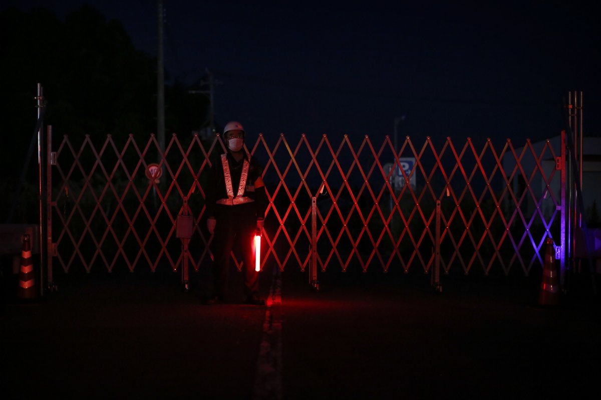 A security barrier blocks the road into the exclusion zone near the tsunami-crippled Daiichi nuclear power plant.