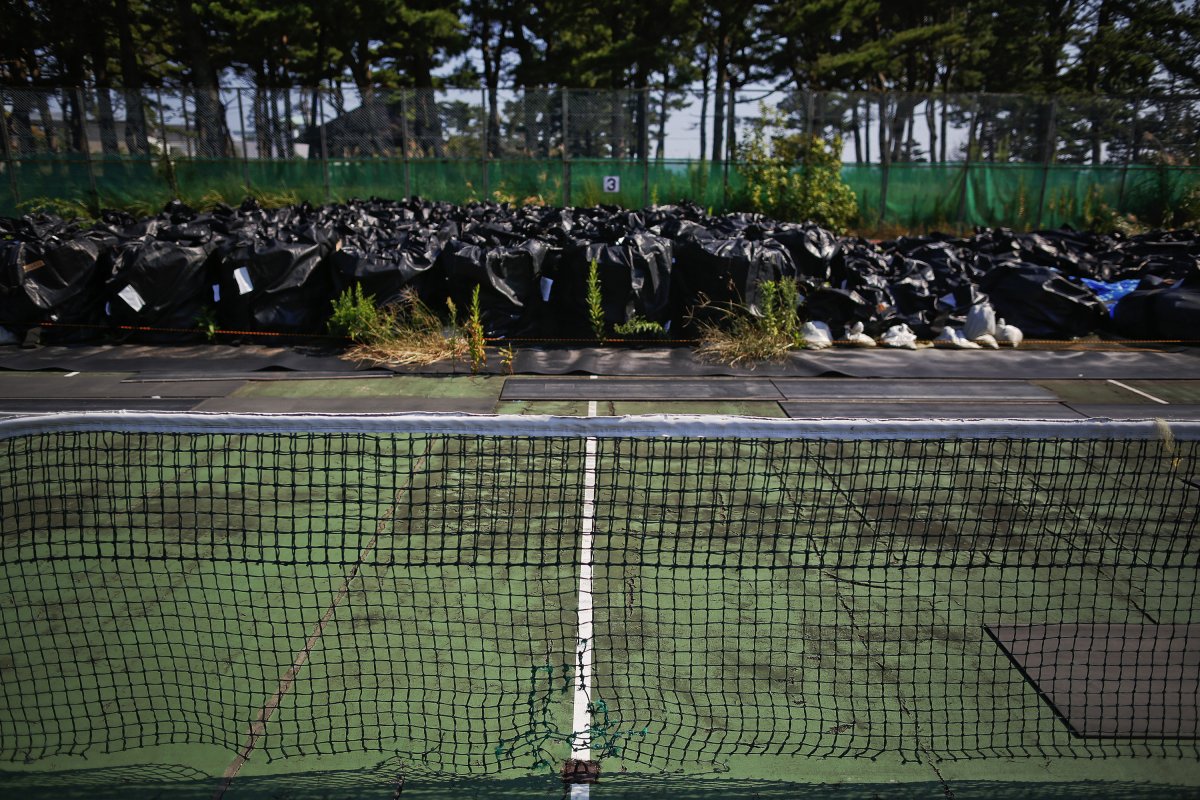 The most ambitious radiation clean-up ever attempted has proved costly and time-consuming since it began two years ago. It may also fail. Most of the contaminated debris (seen here collected in plastic bags) remains piled up in driveways and empty lots because of fierce opposition from local communities to storing it in one place. 