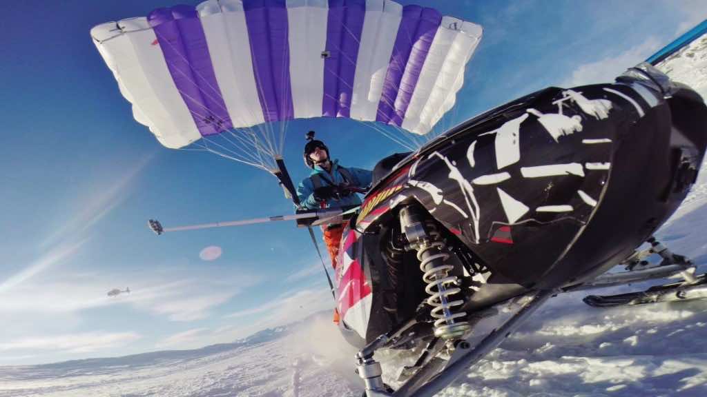Parachute To A Snowmobile And Rides Off A Cliff