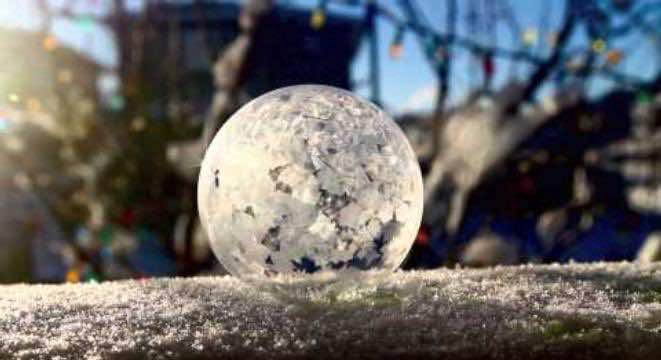 Bubble frozen into ice sphere