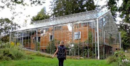 Swedish Couple Constructs A Greenhouse Around Their Home To