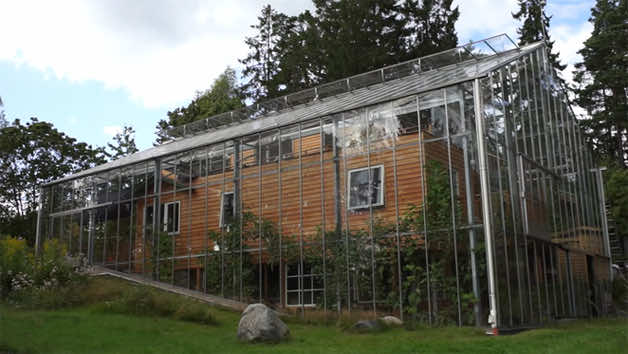 Swedish Couple Constructs A Greenhouse Around Their Home To