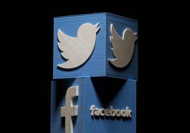 3D-printed Facebook and Twitter logos are seen in this picture illustration made in Zenica