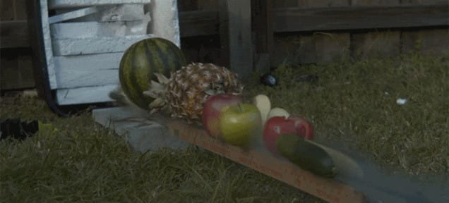 Knife slicing through fruit