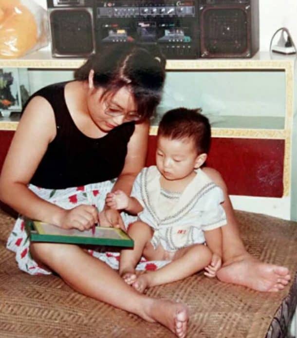 Zuo Hongyan teaches her disabled baby boy Ding Ding.