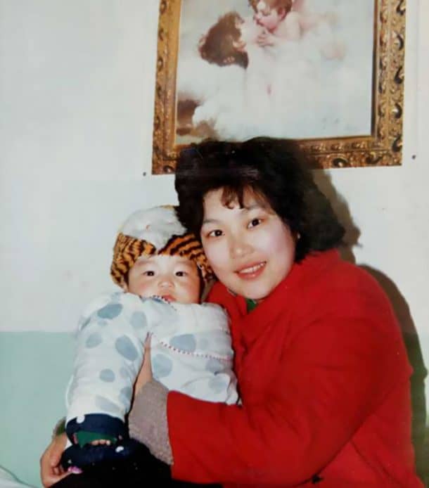 Zuo Hongyan holding disabled baby Ding Ding.